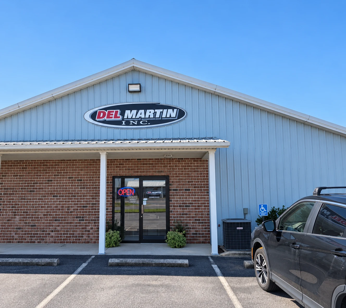 Edited photo of the Del Martin building and showroom entrance in Greencastle