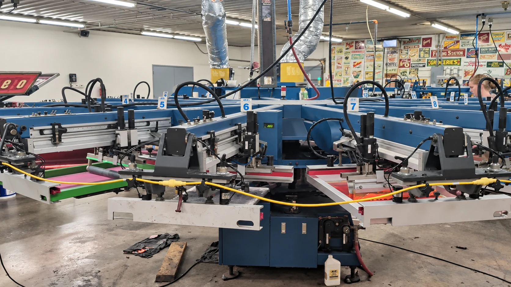 Edited frame from Del Print’s shop video showing its automatic screen printing press