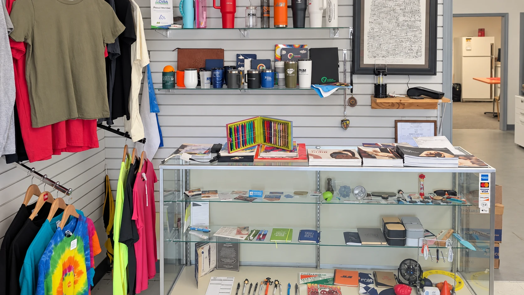 Edited photo of drinkware and promotional samples in the Del Print showroom